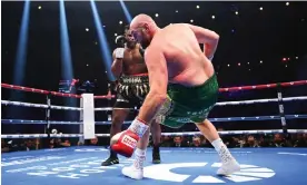  ?? Justin Setterfiel­d/Getty Images ?? Tyson Fury was knocked down in the third round by Francis Ngannou but staged a comeback to win by a point. Photograph: