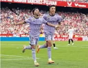  ?? REUTERS ?? Real Madrid’s Rodrygo, left, celebrates scoring their second goal with Alvaro Rodriguez.