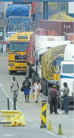  ?? Picture: Katherine Muick-Mere ?? Trucks roll out of Zimbabwe through Beit Bridge to SA. Zimbabwe’s new government wants to encourage more foreign investment — especially from its top business partner, which is SA.