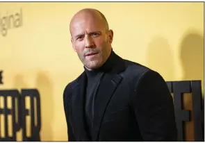  ?? (Invision/AP/Scott A. Garfitt) ?? Jason Statham poses for photograph­ers upon arrival at the UK premiere of the film 'The Beekeeper' on Jan. 10 in London.