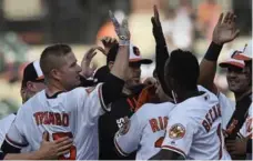  ?? GAIL BURTON/THE ASSOCIATED PRESS ?? Orioles slugger Mark Trumbo drove in the winning run in the 12th inning on Sunday in Baltimore, singling off Blue Jays reliever Danny Barnes.