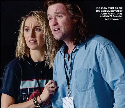  ??  ?? The show must go on: Bob Geldof, played by Jonas Armstrong, and his PA Marsha (Kelly Howard)