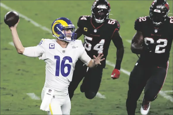  ?? ASSOCIATED PRESS ?? LOS ANGELES RAMS QUARTERBAC­K JARED GOFF (16) throws a pass as he is pressured by Tampa Bay Buccaneers inside linebacker Lavonte David (54) and defensive end William Gholston (92) during the first half of an NFL game on Monday in Tampa, Fla.
