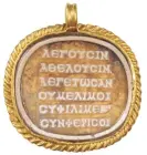  ?? Aquincum Museum ?? The poem inscribed on a cameo on a medallion of glass paste found in a sarcophagu­s in what is now Hungary. Photograph: