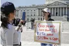  ?? AP ?? A Tiktok content creator speaks outside the U.S. Capitol on Tuesday as senators prepared to consider legislatio­n to force Tiktok’s China-based parent company to sell the social media platform.