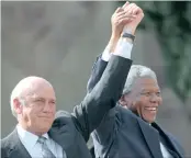  ??  ?? NEW DAWN: Nelson Mandela and former second deputy president FW de Klerk address a crowd of people in front of the Union Buildings after the first presidenti­al inaugurati­on on May 10, 1994.