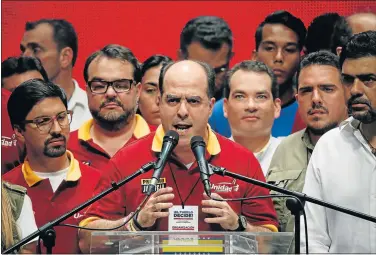  ?? Picture: REUTERS ?? DECISIVE TIMES: Julio Borges, centre, president of the National Assembly and deputy of the Venezuelan coalition of opposition parties addresses the media after an unofficial plebiscite against President Nicolas Maduro's plan to rewrite the constituti­on