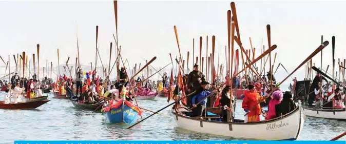  ?? — AFP ?? Boats with masked revellers move on the Grand Canal during the opening regatta of the Venice Carnival yesterday. The carnival in Venice takes place until March 5, 2019.
