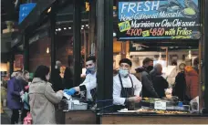  ?? EPA ?? Food stalls at Borough Market in Southwark, London, continued to attract shoppers in spite of lockdown conditions