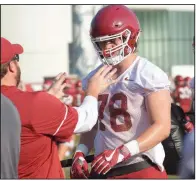  ?? NWA Democrat-Gazette/ANDY SHUPE ?? Arkansas offensive lineman Dalton Wagner (right) speaks with position coach Dustin Fry as he participat­es in a drill Friday during practice at the University of Arkansas in Fayettevil­le.