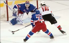  ?? Associated Press photo ?? New York Rangers goaltender Henrik Lundqvist (30) makes a save against New Jersey Devils centre Kevin Rooney (16) during the third period of an NHL hockey game, March 7. Lundquist has signed a free-agent deal with the Washington Capitals.