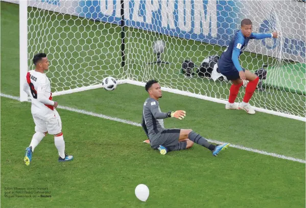  ?? — Reuters ?? Kylian Mbappe scores France’s goal as Peru’s Pedro Gallese and Miguel Trauco look on.