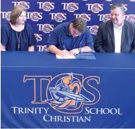  ?? Submitted
photo ?? ■ Trinity Christian School’s Matthew Jones, with
parents Greg and
Christi Jones, signs his national
letter of intent to join East Texas
Baptist University’s inaugural
lacrosse team this
fall.