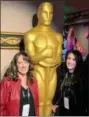  ?? PHOTO SUBMITTED BY DEE SMITH ?? Dee Smith and her daughter Brittany pose with a giant Oscar statue at this year’s Academy Awards.