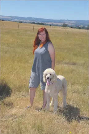  ??  ?? Millie loves company . . . Ann Laherty-Hunt and her dog Millie on the Ruffy property.