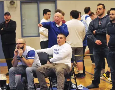  ?? File photo by Ernest A. Brown ?? Cumberland coach Steve Gordon, back, won five state titles in his five-decade career, but the most dramatic was the 2012 title when Tom Lacroix picked up a bonus-point win in the 189-pound state final to earn the Clippers a one-point win.