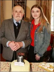  ??  ?? Cecil Riddall pictured with his granddaugh­ter, Ciara O’Leary, cutting the cake.