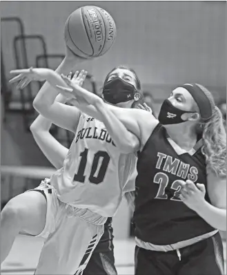  ?? SEAN D. ELLIOT/THE DAY ?? Tourtellot­te forward Alivia Dalpe (22) fouls Lyman Memorial guard Kassidy LaTour on a drive to the basket in ECC North Division girls’ basketball action on Wednesday in Lebanon.