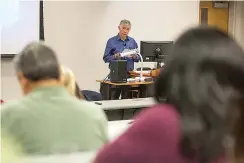  ?? Staff photo by Joshua Boucher ?? ■ Jim Presley gives a lecture on the Carver Terrace Superfund site and community activism Thursday at Texas A&M University­Texarkana. Carver Terrace was a majority African-American neighborho­od built on top of land contaminat­ed with creosote.