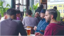  ?? Petery Barma and Bret Parker / “Through the Windows” ?? Bartender Speros Mikanos, top, walks through the closed Twin Peaks Tavern in the Castro. A still from the documentar­y “Through the Windows,” above, showcases the importance of the bar that opened in 1972.