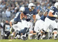  ?? RICH BARNES, USA TODAY SPORTS ?? Getting running back Saquon Barkley (26) started early is key to Penn State holding off Wisconsin’s pass rush.