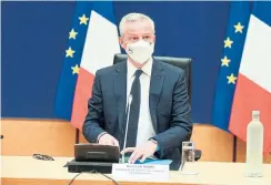  ?? ERIC PIERMONT AFP VIA GETTY IMAGES ?? Economy and Finance Minister Bruno Le Maire said France is considerin­g easing the cost of rising energy bills for consumers. It’s already handing out vouchers worth about $244 per year to nearly 5.5 million poor households.
