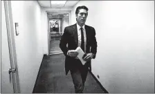  ?? THE WASHINGTON POST BY RICK WENNER ?? David Muir walks through the halls at ABC News studios in New York.