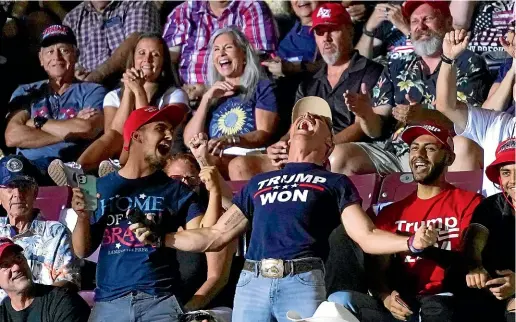  ?? AP ?? Supporters of former President Donald Trump cheer on Kari Lake, a candidate for the Republican gubernator­ial nomination, during her speech at a Save America rally in Prescott, Arizona.