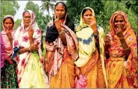  ?? PHOTO: AFP ?? Women show their inked fingers after casting their ballots in the general election outside a polling station in Seoraguri, India, yesterday.