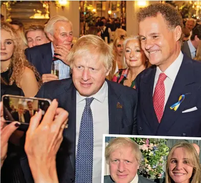  ?? ?? Special guest: Viscount Rothermere and his wife, Claudia, pose for pictures with Boris Johnson