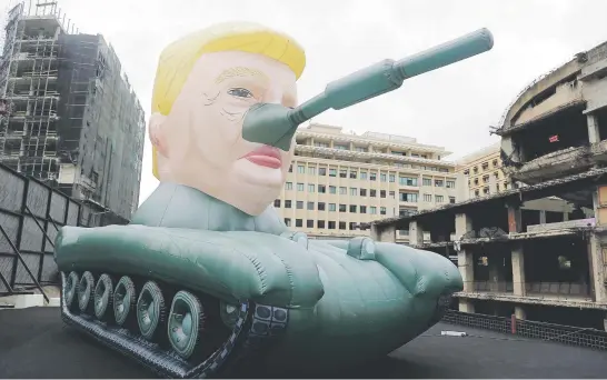  ?? Picture: AFP ?? A giant inflatable tank bearing the head of US President Donald Trump is displayed outside an exhibition by anonymous artist Saint Hoax at the Dome City Centre known as ‘The Egg’ in downtown Beirut.