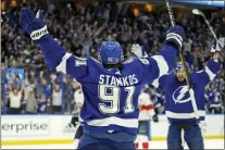  ?? CHRIS O’MEARA — THE ASSOCIATED PRESS ?? Tampa Bay Lightning center Steven Stamkos (91) celebrates his goal against the Florida Panthers with right wing Nikita Kucherov (86) during the second period in Game 3 on Sunday.