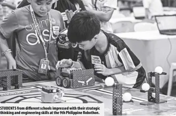  ?? ?? STUDENTS from different schools impressed with their strategic thinking and engineerin­g skills at the 9th Philippine Robothon.