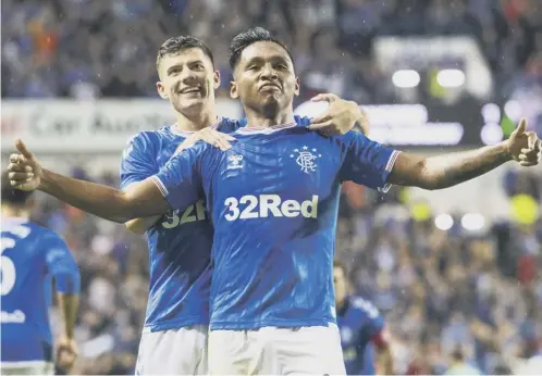  ??  ?? 0 Joy for Alfredo Morelos as he celebrates the stoppage time goal that defeated Legia Warsaw at Ibrox in the Europa League play-off.