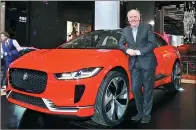  ??  ?? Ian Callum, Jaguar’s design director, presents his latest work at the ongoing Shanghai auto show: the concept I-PACE, the marque’s first pure electric model, which will hit the Chinese market in 2018.