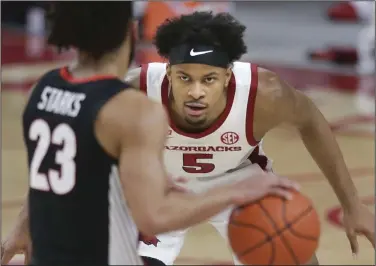  ?? (NWA Democrat-Gazette/Charlie Kaijo) ?? Arkansas guard Moses Moody, who declared for the NBA Draft on Friday, is projected by The Athletic and NBADraft.net as the No. 7 pick. Other mock drafts have Moody taken as high as the No. 9 pick and as low as the No. 21 selection.