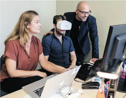  ?? DARIO AYALA FOR NATIONAL POST ?? Isabel Galiana, co-founder and chief executive of Saccade Analytics, Sam Collins, centre, and Richard Chénier, director-general of Centech, at the Centech incubator offices in Montreal.