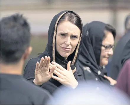  ?? AFP ?? New Zealand’s Prime Minister Jacinda Ardern gestures as she departs following a gathering for victims of the twin mosque massacre at Hagley Park in Christchur­ch in 2019.