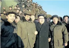  ??  ?? North Korean leader Kim Jong-Un, centre, is surrounded by soldiers of the Korean People’s Army as he inspects the test-launch of a medium long-range ballistic missile. GETTY IMAGES