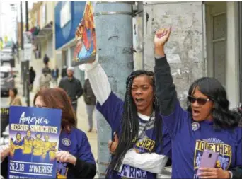  ?? PETE BANNAN — DIGITAL FIRST MEDIA ?? Jaquel Cornelius of Philadelph­ia and Linda Knox of Media take part in a rally Delaware County Children & Youth Services office in Upper Darby Monday. at the