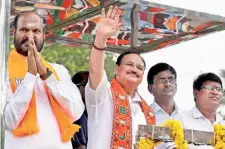  ?? ANI ?? RALLYING SUPPORT. BJP National President JP Nadda with party candidate B John Pandian at a roadshow in Tenkasi