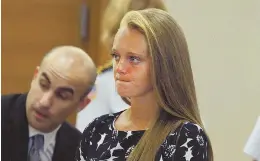  ?? HERALD POOL PHOTO ?? WAITING: Michelle Carter stands in Taunton Juvenile Court yesterday as her lawyers ask a judge to keep out statements she made to police after her boyfriend’s suicide.