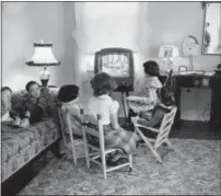  ?? THE ASSOCIATED PRESS ?? In this file photo, four school children watch a teacher giving them a lesson via television at home in Baltimore, Md. TV was key to the world baby boomers were born into: a newly modernized world whose every problem (with the possible exception of the...