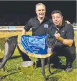  ??  ?? 2017 Darwin Cup-winning trainers Brian Kelleher and Tom Tzouvelis with winning bitch Off And On.