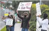  ?? BILL WECHTER ?? Around 35 students protest in front of Earl Warren Middle School on Thursday.