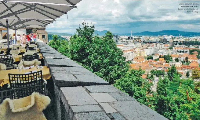  ?? (Photos: Bloomberg) ?? Strelec restaurant is in the Ljubljana Castle, with a terrace overlookin­g the city