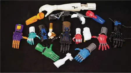  ?? JEN OWEN / ENABLING THE FUTURE ?? The e-Nable global community has created several prosthetic hand designs and prototypes.