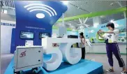  ?? CHEN XIAOGEN / FOR CHINA DAILY ?? A booth showcasing 5G technology at an industry expo in Beijing.