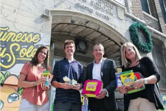  ??  ?? (From left to right) Sun Youth’s Mary Bottero and Eric Kingsley accepted the donation of school supplies brought in by Cyrille Aubin and Lori Buckberrou­gh from RBC Dominion Securities.