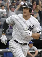  ?? ASSOCIATED PRESS FILE PHOTOS ?? Los Angeles Dodgers first baseman Cody Bellinger, left, and New York Yankees outfielder Aaron Judge, right, were unanimousl­y voted 2017Rookie­s of the Year in the National League and American League, respective­ly.